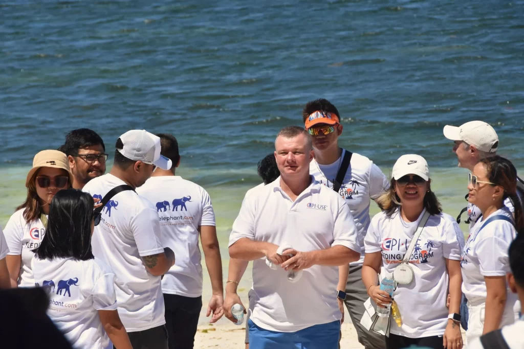 Team Building Groups gathered by the white beach for activities