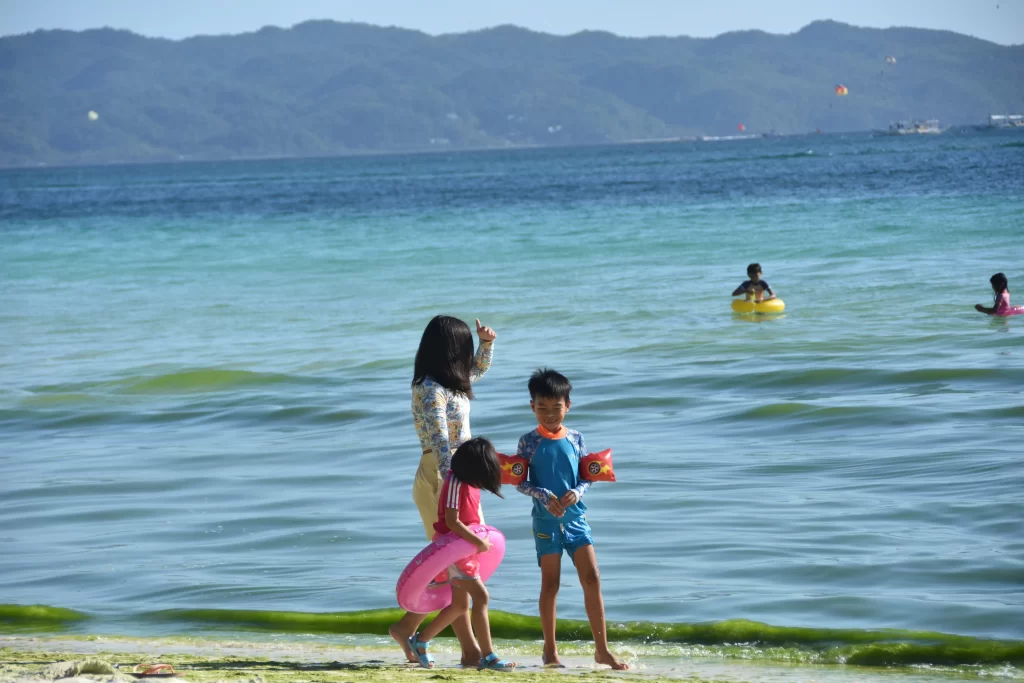 kids playing by the white beach Boracay