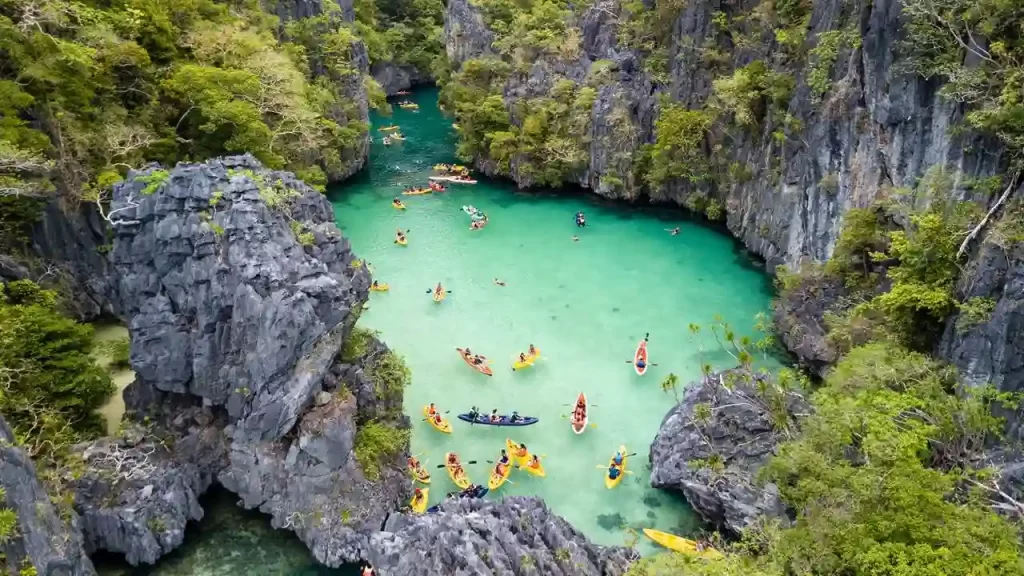 El Nido Lagoon from aerial with tourist having activities