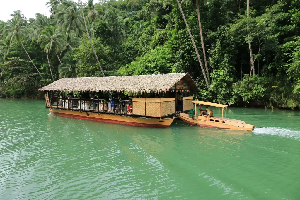 Floating attraction featuring a Filipino food accompanied by traditional singing & dancing at Loboc River Cruise Bohol