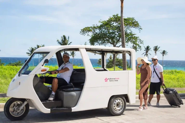 A woman taking an e-tricycle with her guide