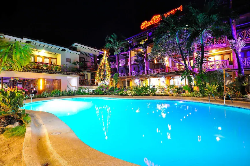 Pool View of Red Coconut Beach Hotel at Night