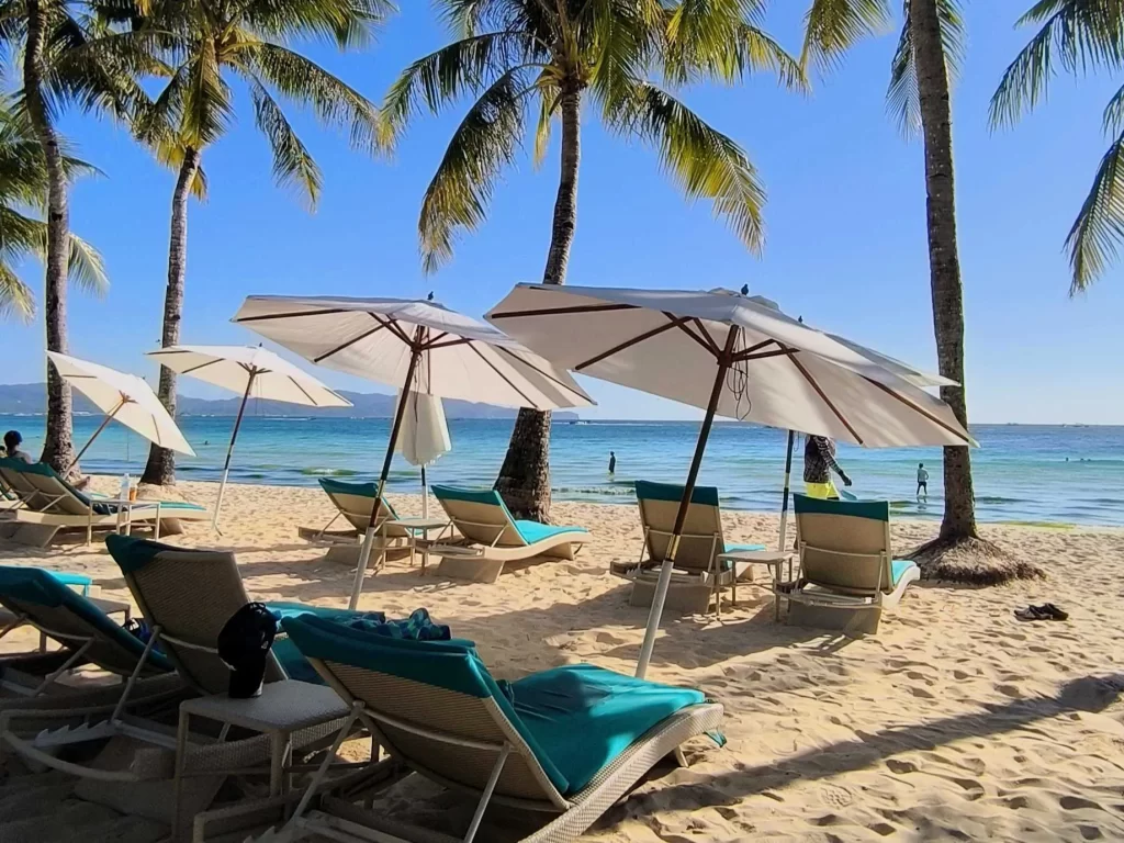 relax on Boracay Beach beds on a sunny day