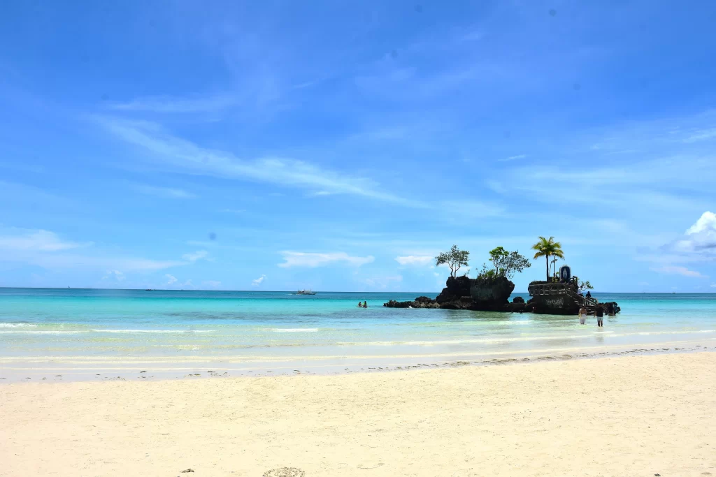 Boracay White Beach coastline with tourists enjoying the beach and water activities