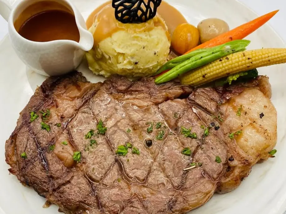Hearty steak and sides served at Christina’s Boracay, popular for romantic dinners and groups.