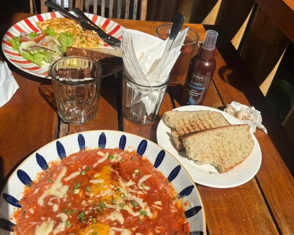 Breakfast meal with eggs, bread, and coffee served at Lazy Dog Bed and Breakfast in Boracay